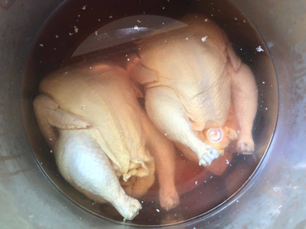 two whole chickens in brine